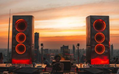 DJ booth with speakers at sunset