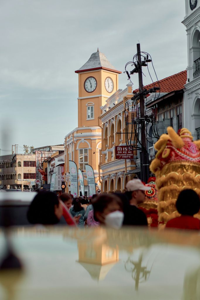 Clock tower and street life in Phuket Town