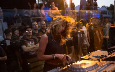 DJ playing to a packed crowd