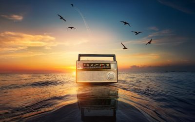 Vintage radio on the sea at sunset